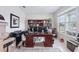 Well-lit home office featuring a large desk, bookshelf, and ample storage space at 13055 Willow Grove Dr, Riverview, FL 33579