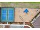 Aerial view of community tennis courts and playground featuring blue play structures and safety mulch surface at 13055 Willow Grove Dr, Riverview, FL 33579