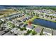 Aerial view of home showcasing pond view and neighborhood at 13130 Monach Isles Dr, Riverview, FL 33579