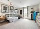 Comfortable bedroom with sports decor, window and a single bed with a baseball themed ceiling at 13130 Monach Isles Dr, Riverview, FL 33579