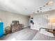 Neutral bedroom features a large closet, single bed, dresser, baseball decor, and decorative ceiling at 13130 Monach Isles Dr, Riverview, FL 33579