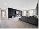 Large bonus room with decorative wall and natural light, perfect for entertaining or Gathering time at 13130 Monach Isles Dr, Riverview, FL 33579