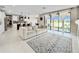 Open concept living room with kitchen views and large sliding doors leading to the backyard at 13130 Monach Isles Dr, Riverview, FL 33579