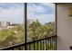 Private balcony with serene views of the community landscaping and nearby building at 1316 Pasadena S Ave # 303, South Pasadena, FL 33707