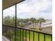 Balcony with views of palm trees and other lush landscaping at 1316 Pasadena S Ave # 303, South Pasadena, FL 33707