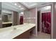 Bathroom featuring an extended vanity, ample lighting, and separate toilet area at 1316 Pasadena S Ave # 303, South Pasadena, FL 33707