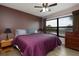 Bedroom with a ceiling fan, large window, and neutral color palette for a calming atmosphere at 1316 Pasadena S Ave # 303, South Pasadena, FL 33707