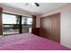 Bedroom featuring a ceiling fan, large window, and generous closet space at 1316 Pasadena S Ave # 303, South Pasadena, FL 33707