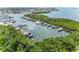 Aerial view of boat docks, showcasing various boats moored in the tranquil waterfront setting at 1316 Pasadena S Ave # 303, South Pasadena, FL 33707