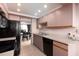 Well-equipped kitchen with modern appliances, ample counter space, and adjacent dining area at 1316 Pasadena S Ave # 303, South Pasadena, FL 33707