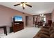 Inviting living room with comfortable seating, a TV, and dining room area at 1316 Pasadena S Ave # 303, South Pasadena, FL 33707