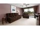Comfortable living room with plush furniture and balcony access that brings in natural light at 1316 Pasadena S Ave # 303, South Pasadena, FL 33707