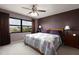 Comfortable main bedroom with a ceiling fan and an outside view at 1316 Pasadena S Ave # 303, South Pasadena, FL 33707