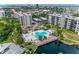 Beautiful aerial view of the community pool, jacuzzi, and surrounding area in this waterfront condo community at 1316 Pasadena S Ave # 303, South Pasadena, FL 33707