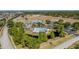 Aerial view of community pool, clubhouse, tennis courts, and recreation fields at 13308 Prestwick Dr, Riverview, FL 33579