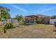 A relaxing backyard with a pergola, seating, and garden at 13308 Prestwick Dr, Riverview, FL 33579