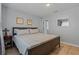 Serene bedroom with a comfortable queen bed, side table, and neutral decor, offering a relaxing retreat at 13308 Prestwick Dr, Riverview, FL 33579