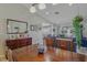 Open-concept dining area with a wooden table, a stylish buffet, and seamless flow to the living area at 13308 Prestwick Dr, Riverview, FL 33579