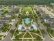 Aerial view of community amenities with pool, gazebo, playground, and landscaped park within a residential neighborhood at 13311 Orca Sound Dr, Riverview, FL 33579