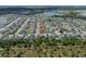 An aerial view showcases the property nestled in a community with lush landscaping and access to nearby amenities and roads at 13311 Orca Sound Dr, Riverview, FL 33579