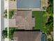 Aerial view of a home showcasing the roof, backyard, and surrounding neighborhood at 13311 Orca Sound Dr, Riverview, FL 33579