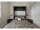 Bedroom featuring a stylish murphy bed with built-in side tables and overhead lighting at 13311 Orca Sound Dr, Riverview, FL 33579