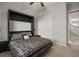 Bedroom features a murphy bed, closet, and a view of the stairs at 13311 Orca Sound Dr, Riverview, FL 33579
