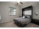 Cozy bedroom featuring a unique murphy bed and soft natural light from the window at 13311 Orca Sound Dr, Riverview, FL 33579
