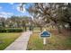 Exterior view of the community dog park with mature trees and well-maintained fencing at 13311 Orca Sound Dr, Riverview, FL 33579