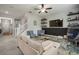 Inviting living room features a cozy seating area, modern shelving, and stylish decor at 13311 Orca Sound Dr, Riverview, FL 33579