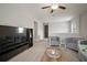Open living space with stylish decor, cozy seating, and plenty of room to relax and unwind at 13311 Orca Sound Dr, Riverview, FL 33579