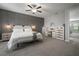 Well-appointed primary bedroom with stylish dresser, accent wall, and soft textures at 13311 Orca Sound Dr, Riverview, FL 33579