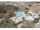 A picturesque aerial view of the community pool, clubhouse, tennis courts and surrounding neighborhood at 13311 Orca Sound Dr, Riverview, FL 33579