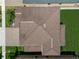 Aerial view of a home featuring a brown shingle roof, manicured lawn, and well-maintained landscaping at 13311 Orca Sound Dr, Riverview, FL 33579