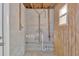 An unfinished basement with block walls and exposed utilities at 13612 Veronica Dr, Hudson, FL 34667