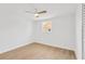Cozy bedroom featuring wood-look floors, ceiling fan, and bright window at 13612 Veronica Dr, Hudson, FL 34667