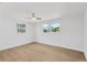 A bedroom with bright lighting and large windows at 13612 Veronica Dr, Hudson, FL 34667