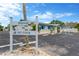 Welcome to Sea Ranch: An inviting low-rise commercial building with a white sign and ample parking at 13612 Veronica Dr, Hudson, FL 34667