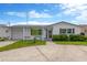 Charming single-story home featuring a well-maintained lawn, covered entry, and attached garage at 13612 Veronica Dr, Hudson, FL 34667