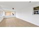Bright living room featuring neutral flooring, ceiling fan, and natural light at 13612 Veronica Dr, Hudson, FL 34667