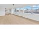 Bright living room with neutral flooring, ceiling fan, and waterfront view at 13612 Veronica Dr, Hudson, FL 34667