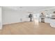 Open-concept living space with recessed lighting, stainless steel refrigerator, and updated kitchen at 13612 Veronica Dr, Hudson, FL 34667