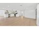 Bright living space featuring tile floors, recessed lighting, and updated kitchen at 13612 Veronica Dr, Hudson, FL 34667