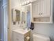 Bathroom with vanity, mirror, storage cabinet, and toilet at 1432 Windjammer Pl, Valrico, FL 33594