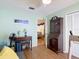 Bedroom featuring a ceiling fan, desk, and a brown hutch with wooden floors at 1432 Windjammer Pl, Valrico, FL 33594