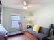 Guest bedroom with neutral walls, a window, and a futon couch at 1432 Windjammer Pl, Valrico, FL 33594