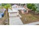 Charming single-Gathering home with a metal roof, two-car garage, and mature landscaping at 1432 Windjammer Pl, Valrico, FL 33594