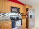 Kitchen with stainless steel appliances, granite countertops, and a stylish backsplash at 1432 Windjammer Pl, Valrico, FL 33594