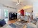 Open living area with casual seating, a ceiling fan, and connecting spaces to other rooms at 1432 Windjammer Pl, Valrico, FL 33594