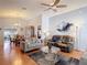 Open concept living room with comfortable seating, ceiling fan, and a clear view into the dining room at 1432 Windjammer Pl, Valrico, FL 33594
